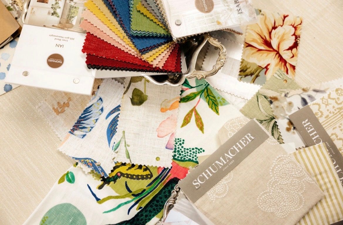 Fabric swatches spread across a table