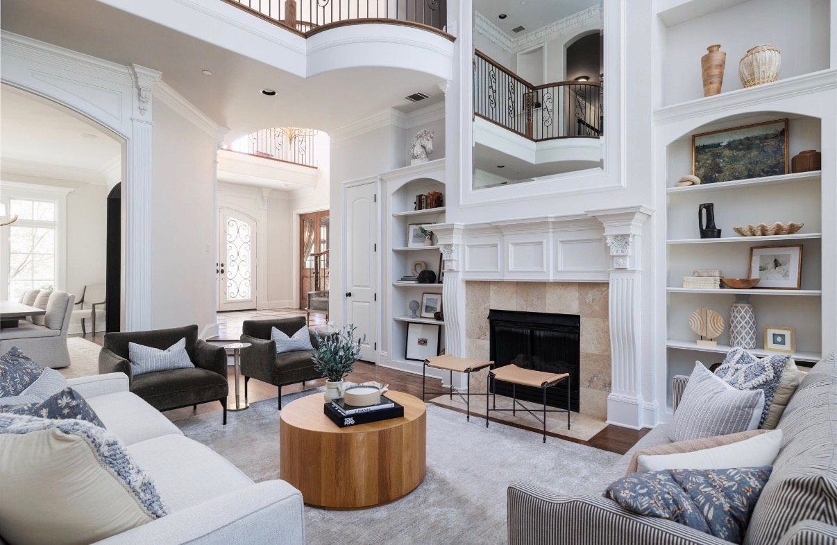 A two-storey living room with arched built-ins, designed by Anna